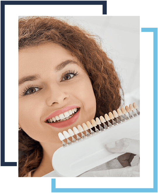 A woman holding a tooth brush with teeth.